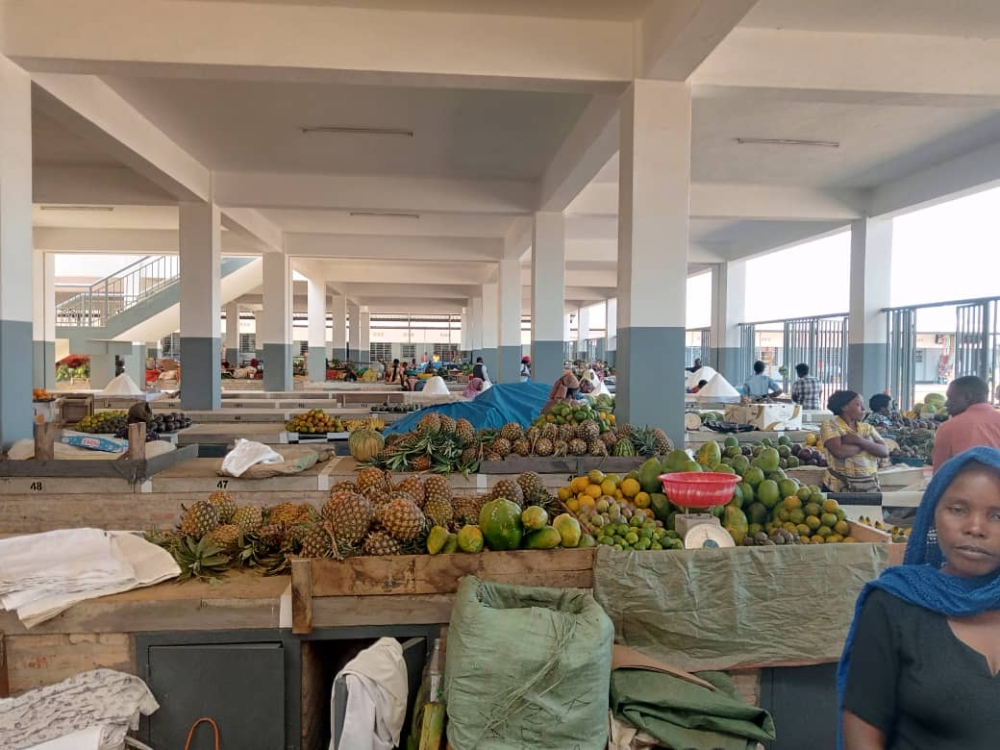 Activity hums under clean, well-lit halls. Traders arrange neat piles of pineapples, avocados, and citrus fruits on wide cement stalls, in the inaugurated  Rwamagana modern market on July 4. - Copy