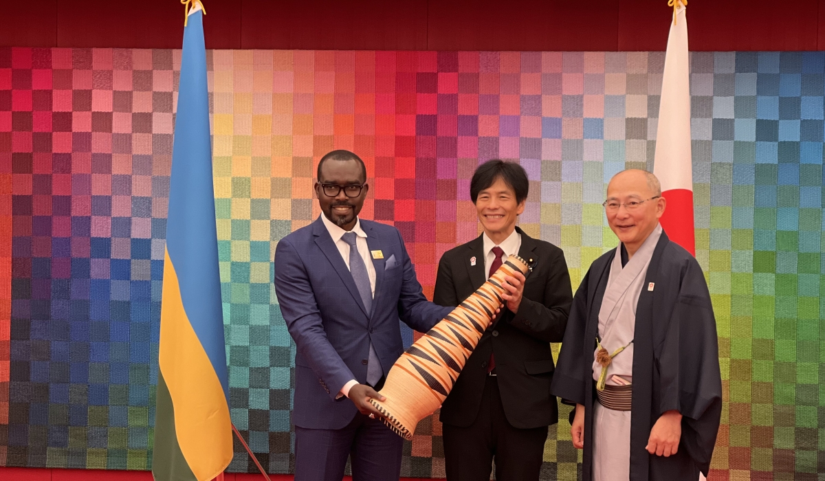 Minister of Trade and Industry Prudence Sebahizi gives a gift to his host in Japan. Photo by Davis Higiro