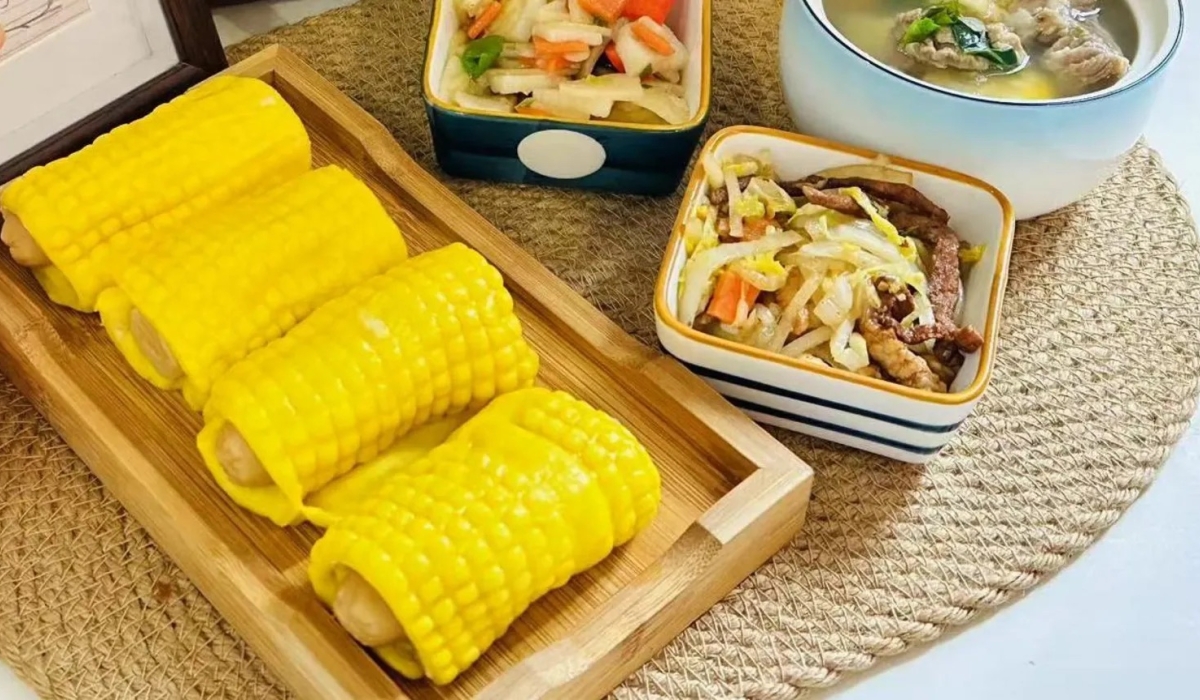 A photo provided by the kindergarten to parents show bright yellow corn rolls and stir-fried vegetables. BBC
