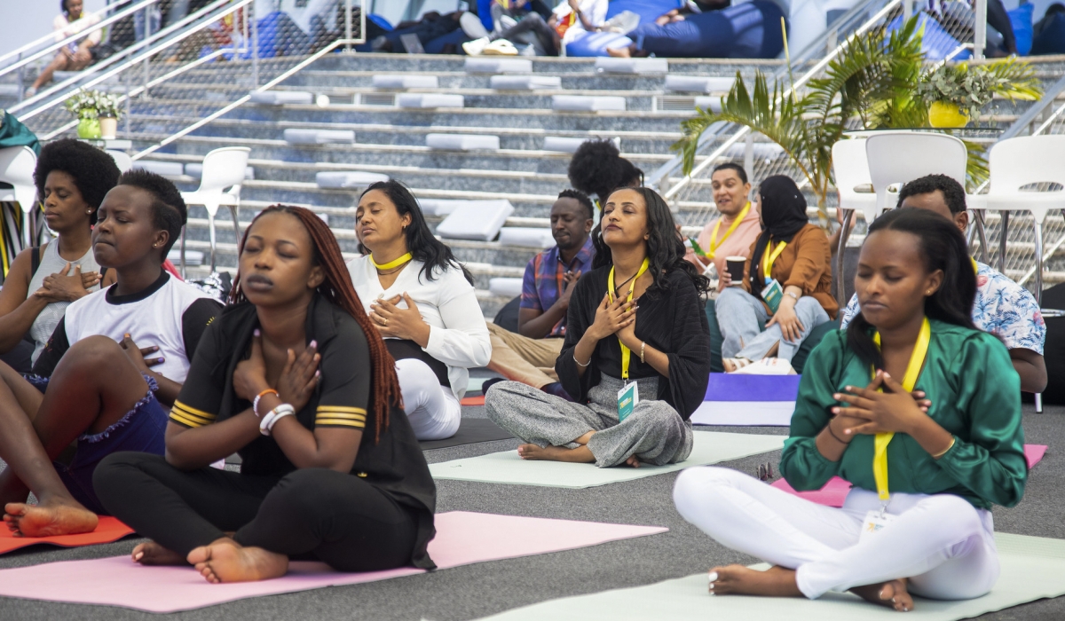 People during a Yoga exercise session at Kigali Convention Centre. Photo by Willy Mucyo