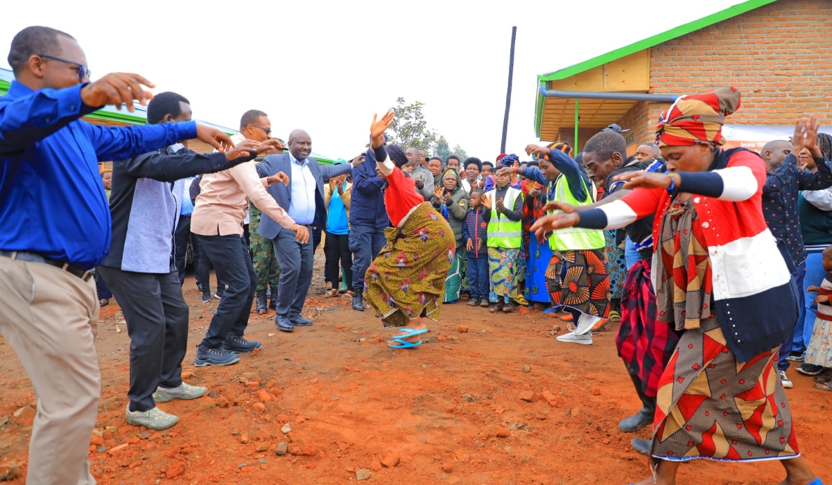 The Minister in charge of Emergency Management , Maj Gen (Rtd) Albert Murasira and other officials dance with residents during the inauguration of the newly constructed houses to accommodate people affected by the disasters in May 2023 in Musanze District. Photos by Germain Nsanzimana