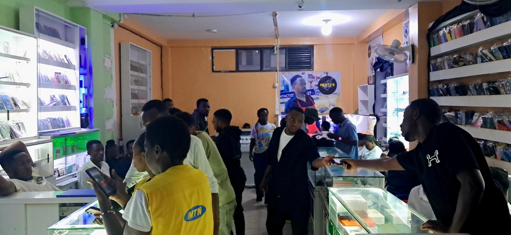Vendors of electronic items in a shared renting space in Kigali. Photo by Frank Ntarindwa