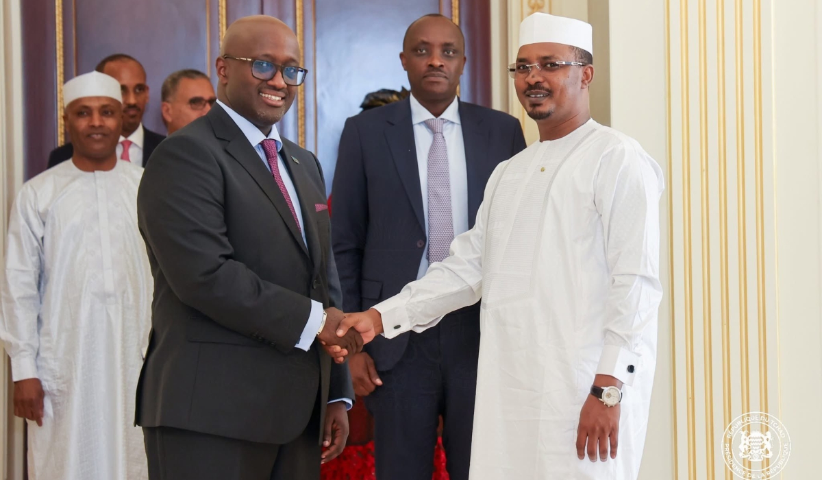 Nduhungirehe (Left) shakes hands with Deby during their meeting on Wednesday, June 16 at the Chadian state house in N&#039;Djamena.