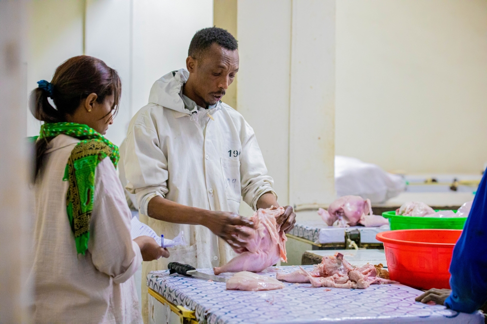 A a vendor who deals in chicken and fish at Nyabugogo market. Photos by Kellya Keza