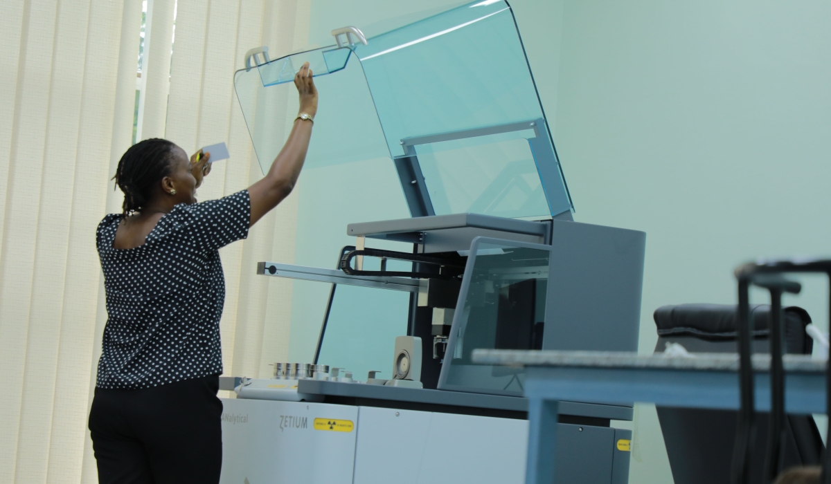 An RMB staff demonstrates how to use Zetium XRF, equipment meant for determining elemental compositions of materials in various forms at the geoscience laboratory in Kicukiro District, Kigali. The lab capacity is to analyse bout 20,000 samples annually, according RMB (courtesy).