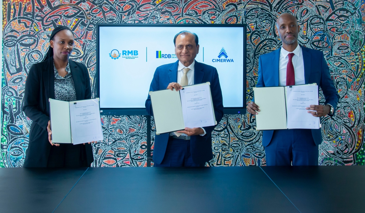 Alice Uwase, Deputy CEO of Rwanda Mining Board (RMB), CIMERWA Group Chairperson Narendra Raval, and Rwanda Development Board (RDB) CEO Jean-Guy Afrika pose for a group photo after the signing ceremony on Thursday, July 17. Courtesy Photo