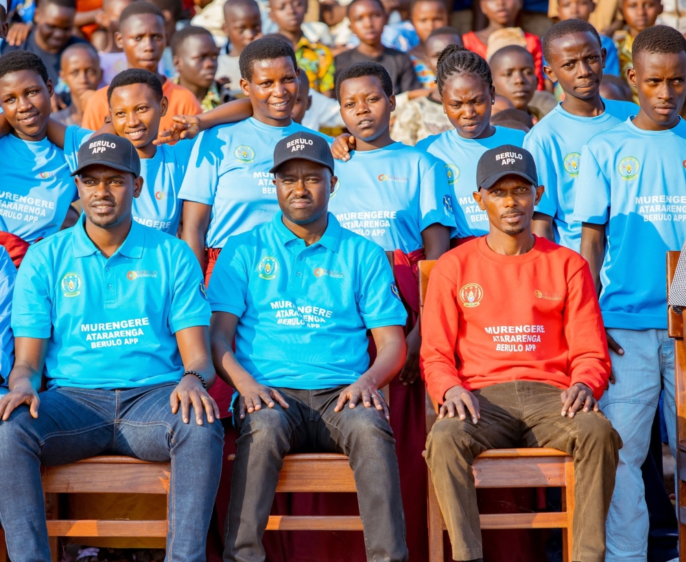 From left, Emmanuel Nkotanyi, youth coordinator; Gisagara District Mayor Jérôme Rutaburingoga; and Ian Berulo Cyusa appear during a community outreach campaign in Gisagara District, one of the areas where the app is active. COURTESY.