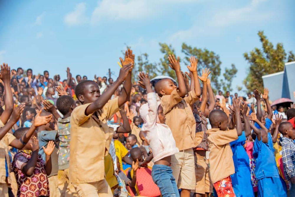 Children engage in various after-school activities to stay active and entertained. Here, they cheer on dancers at a newly opened youth-friendly center in Gisagara.
