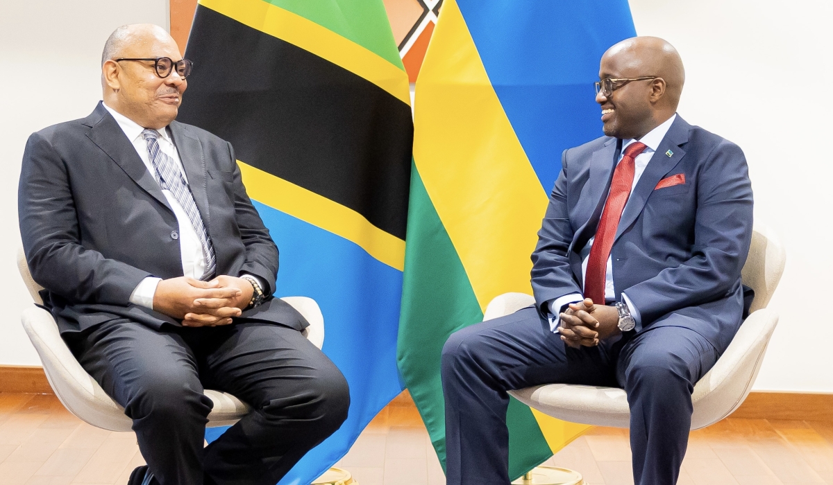 Tanzania&#039;s Minister of Foreign Affairs and East African Cooperation, Mahmoud Thabit Kombo (L), chats with Rwanda’s Minister of Foreign Affairs and International Cooperation, Olivier Nduhungirehe, at the ministerial session of the 16th Joint Permanent Commission between Rwanda and Tanzania, on Saturday, July 26, in Kigali (courtesy). 