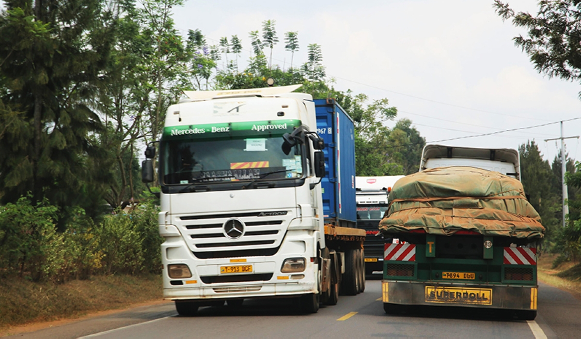 Cross-border cargo trucks transport goods from Dar es salaam to Kigali. File