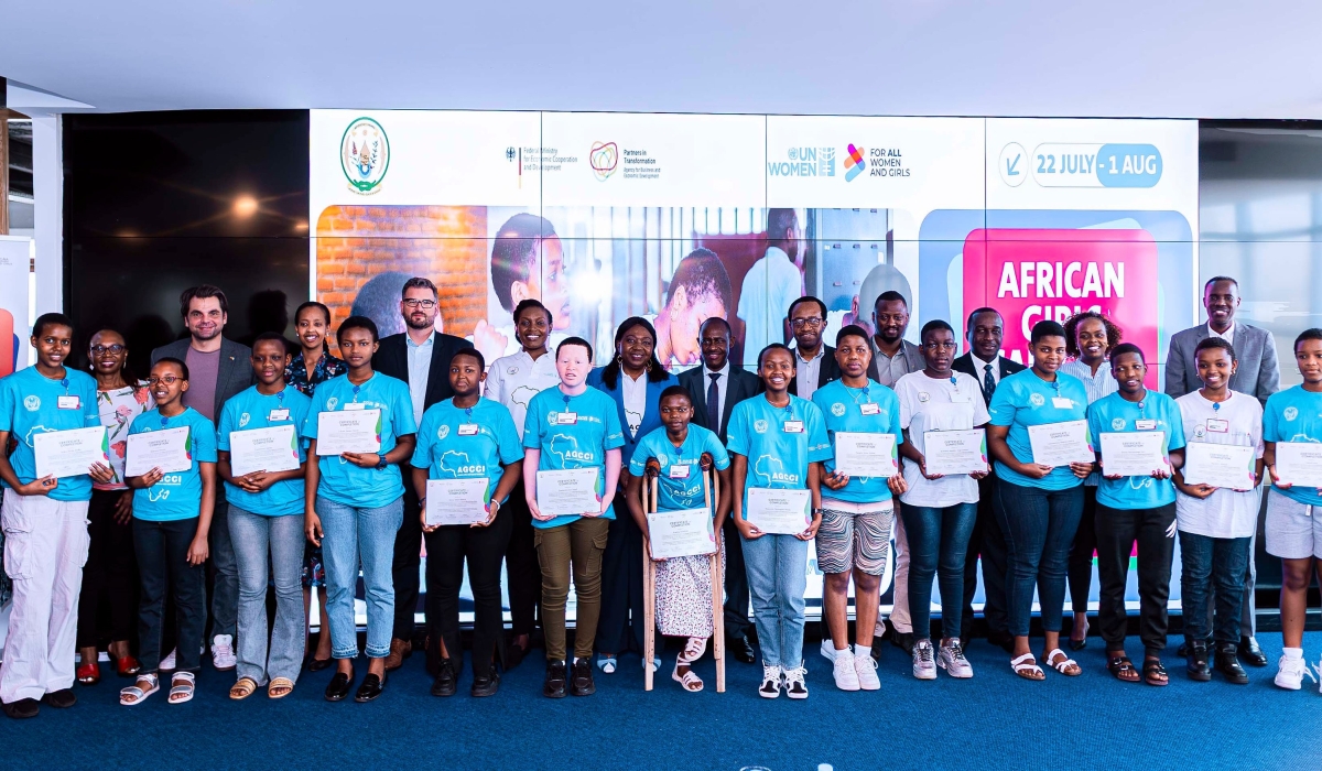 Girls who graduated from the third cohort of the African Girls Can Code Initiative pose for a photo with officials on Thursday, July 31. The program equips young women with digital and tech skills.