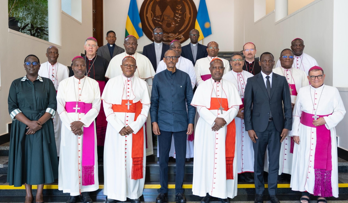 President Kagame poses for a photo with Catholic clerics visiting his office on Saturday, August 2. Photo by Village Urugwiro