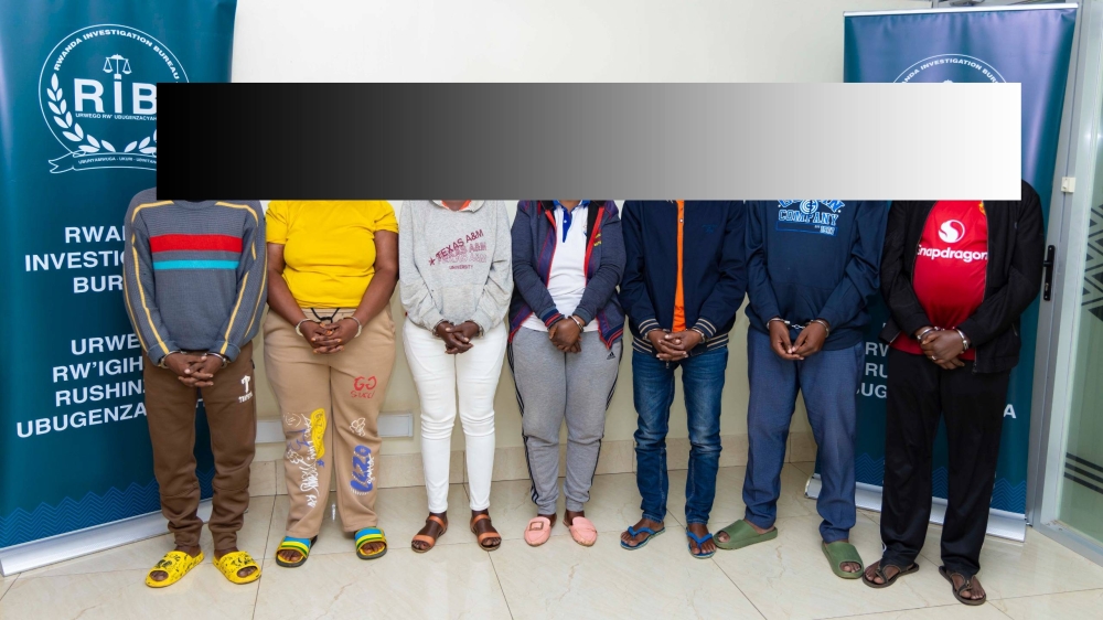 A group of suspects presented to the journalists at Rwanda Investigation Bureau Headquarters on June 30. They were  suspected of selling land that does not belong to them. Courtesy
