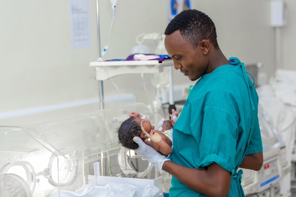 A neonatal health professional attends to a new-born baby at Kirehe District Hospital. In a bid to give more people opportunity to have children, Rwanda has expanded access to surrogacy. Photo by Ministry of Health.
