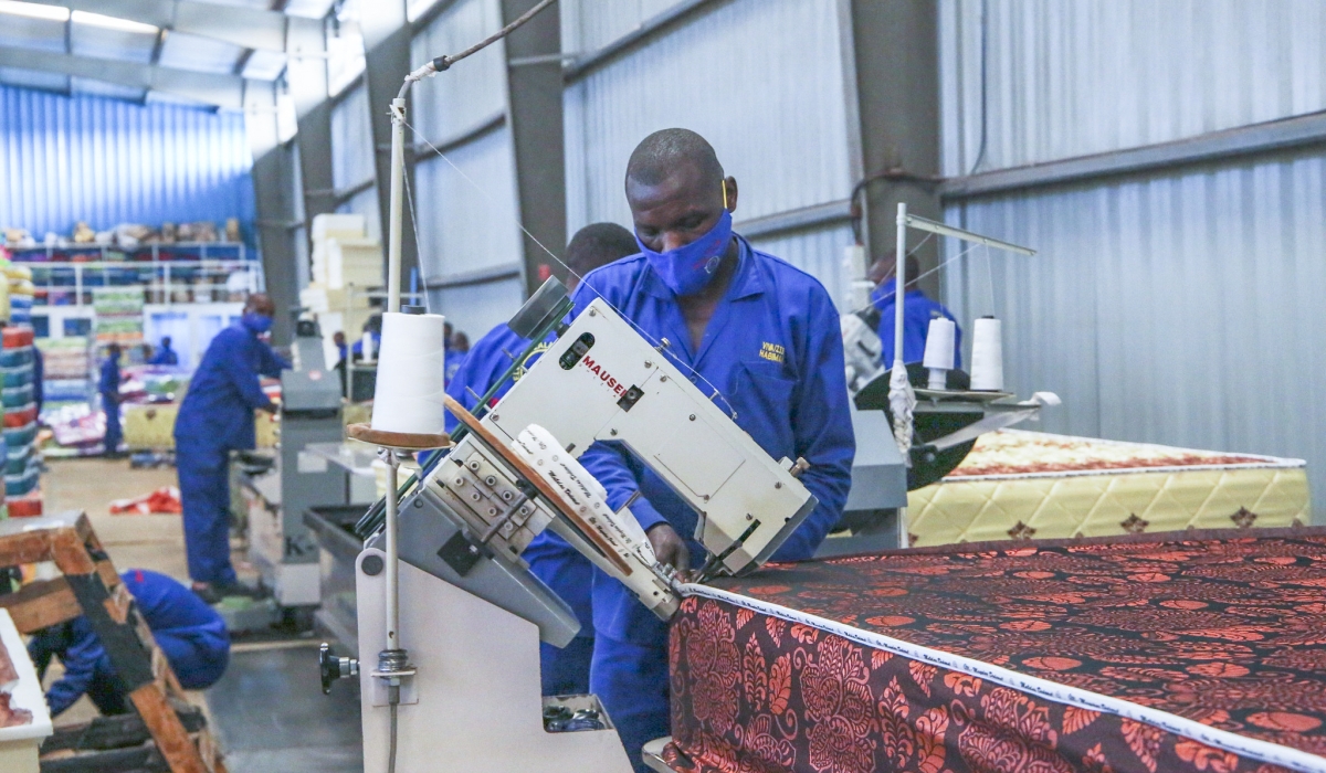 Workers on duty in a mattress firm at Kigali Special Economic Zone. Photo by Craish BAHIZI