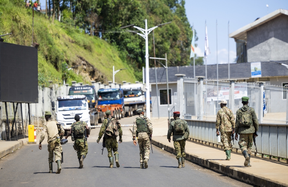 M23 fighters walk at Rwanda-DR Congo border at Rusizi on February 16, 2025.  Photo by Olivier Mugwiza