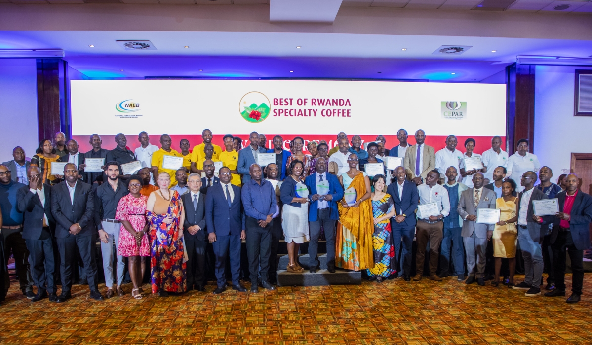 Officials and farmers who were awarded pose for a group photo during the awarding ceremony on Wednesday, August 13. Craish BAHIZI