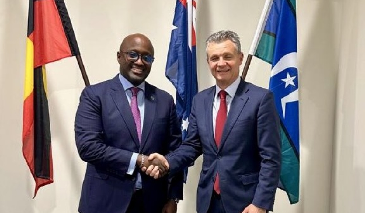 The two officials shake hands after their meeting on Friday. Photo by Ministry of Foreign Affairs