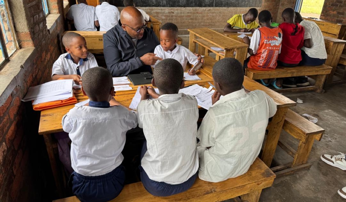 Rwanda Education Board Director General visits students during remedial learning program. Courtesy