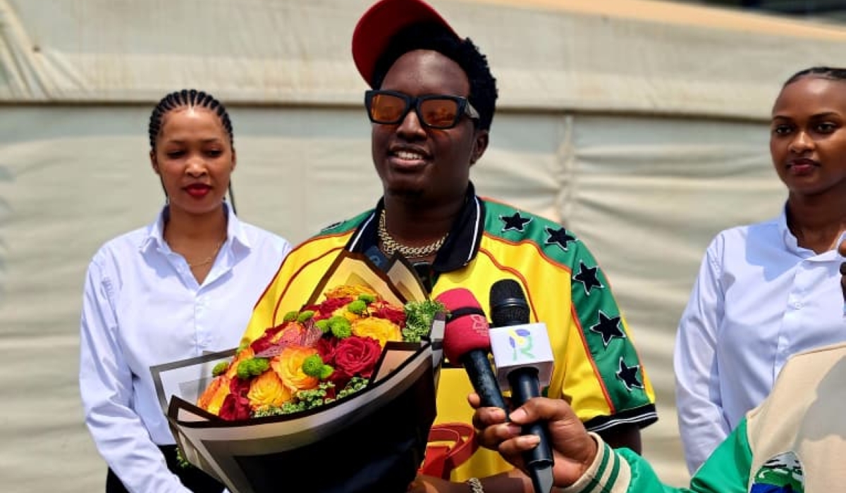 The artiste speaks to journalists at Kigali International Airport