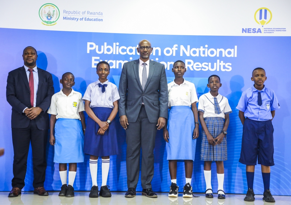 Minister of Education Joseph Nsengimana pose for photo with the best performers.