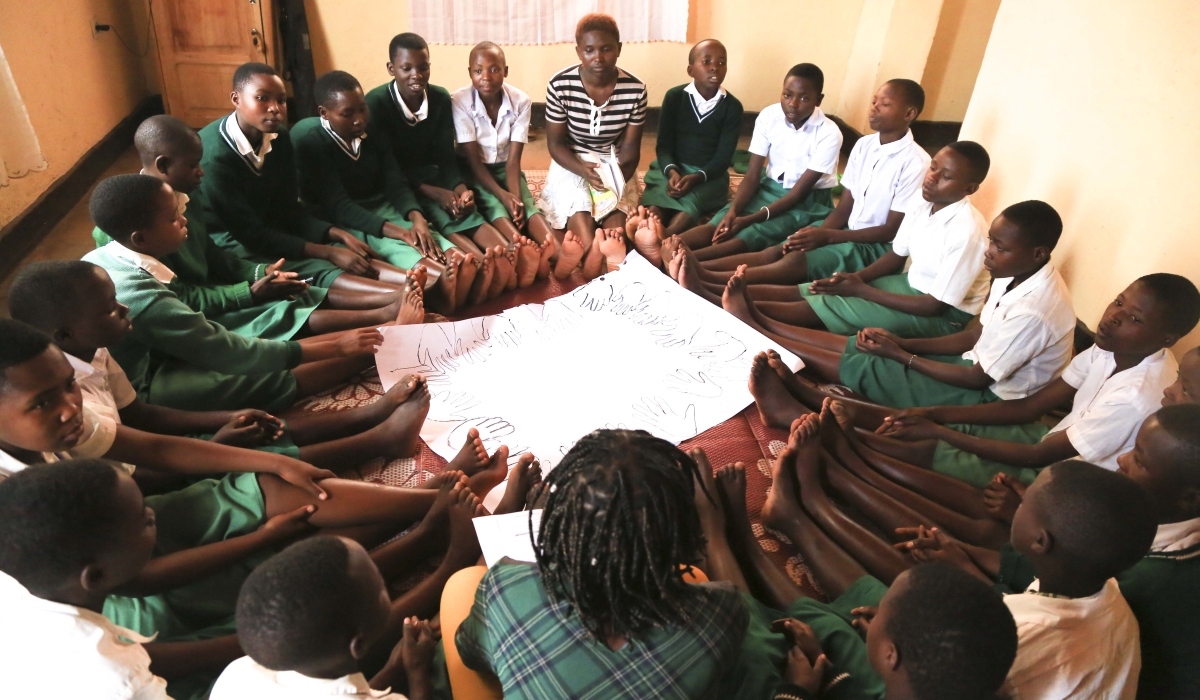 Girls follow an interaction space during a reproductive session at GS Gisagara