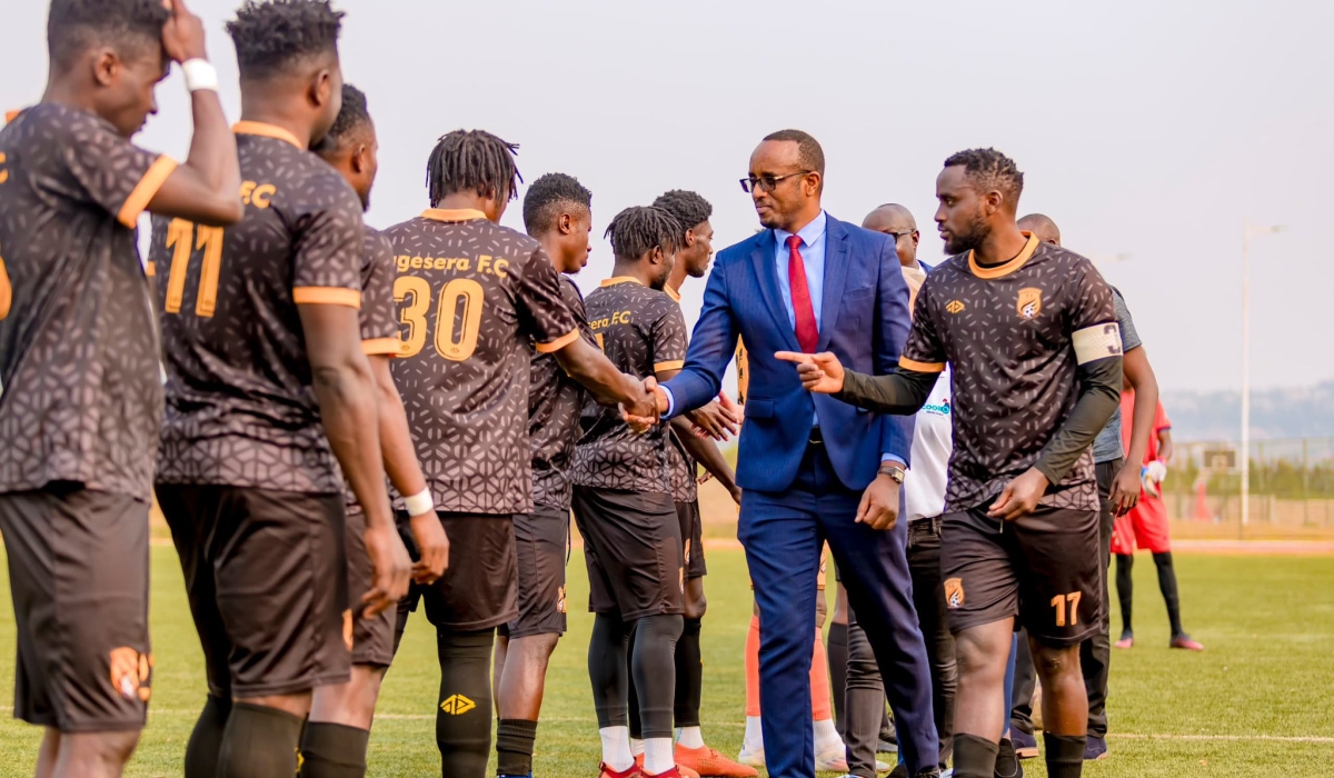 Mayor of Bugesera Richard Mutabazi greets Bugesera FC players before a friendly match to unveil new players at Bugesera Stadium. Courtesy