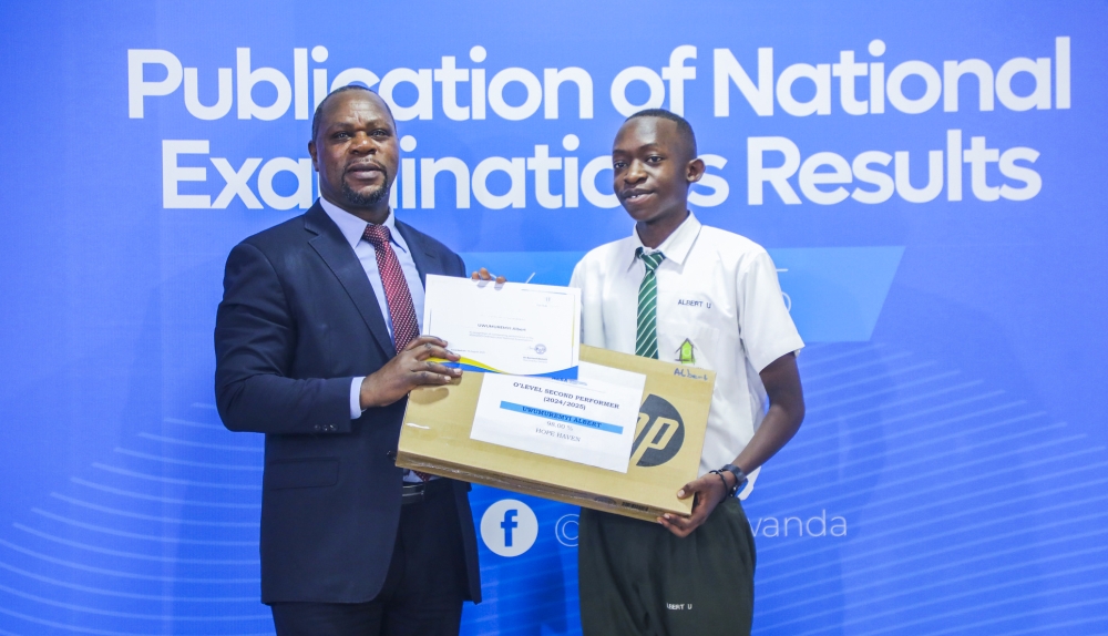 NESA Director General, Bernard Bahati, awards Albert Uwumuremyi from Hope Haven  School,  during the release of the results on Tuesday, August 19. Photo by  Craish Bahizi