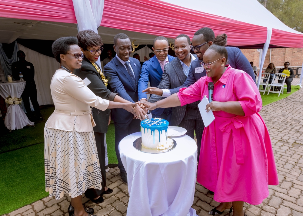 Officials cut a cake to celebrate the World Humanitarian Day in Kigali on Tuesday, August 19. All photos by Titus Manzi