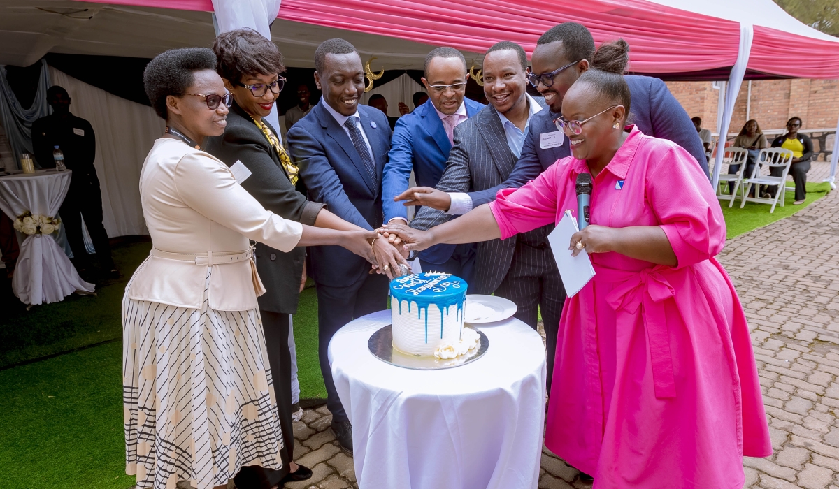 Officials cut a cake to celebrate the World Humanitarian Day in Kigali on Tuesday, August 19. All photos by Titus Manzi