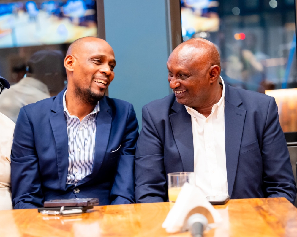 Rayon Sports Association President Thadée Twagirayezu and Paul Muvunyi, Chairman of Rayon Sports’ Supreme Organ interacts at the launch of the online platform. Courtesy