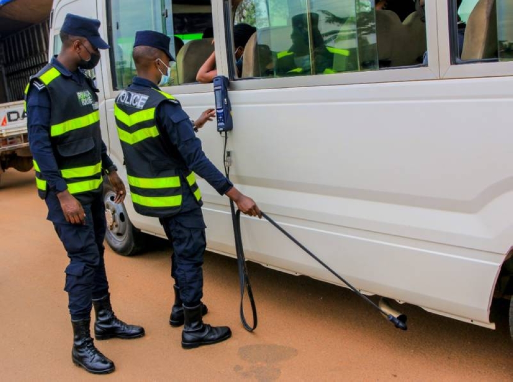 Rwanda National police officers inspect fuel powerd vehicle during an exercise in Kigali. Rwanda has begun enforcing mandatory emission tests for all fuel-powered vehicles.