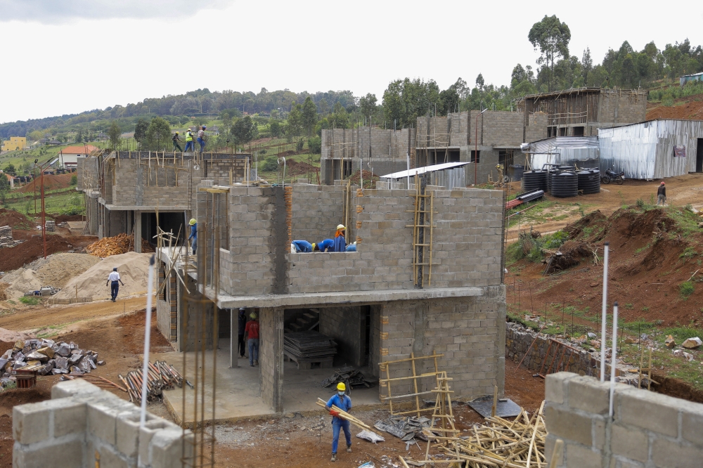 Workers on duty a a construction project in Kicukiro. Photo by Craish Bahizi