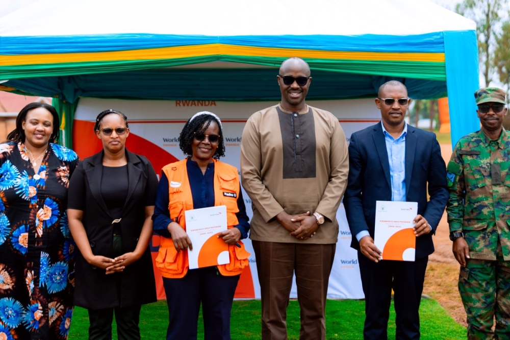 Officials pose for a group photo at the handover ceremony.
