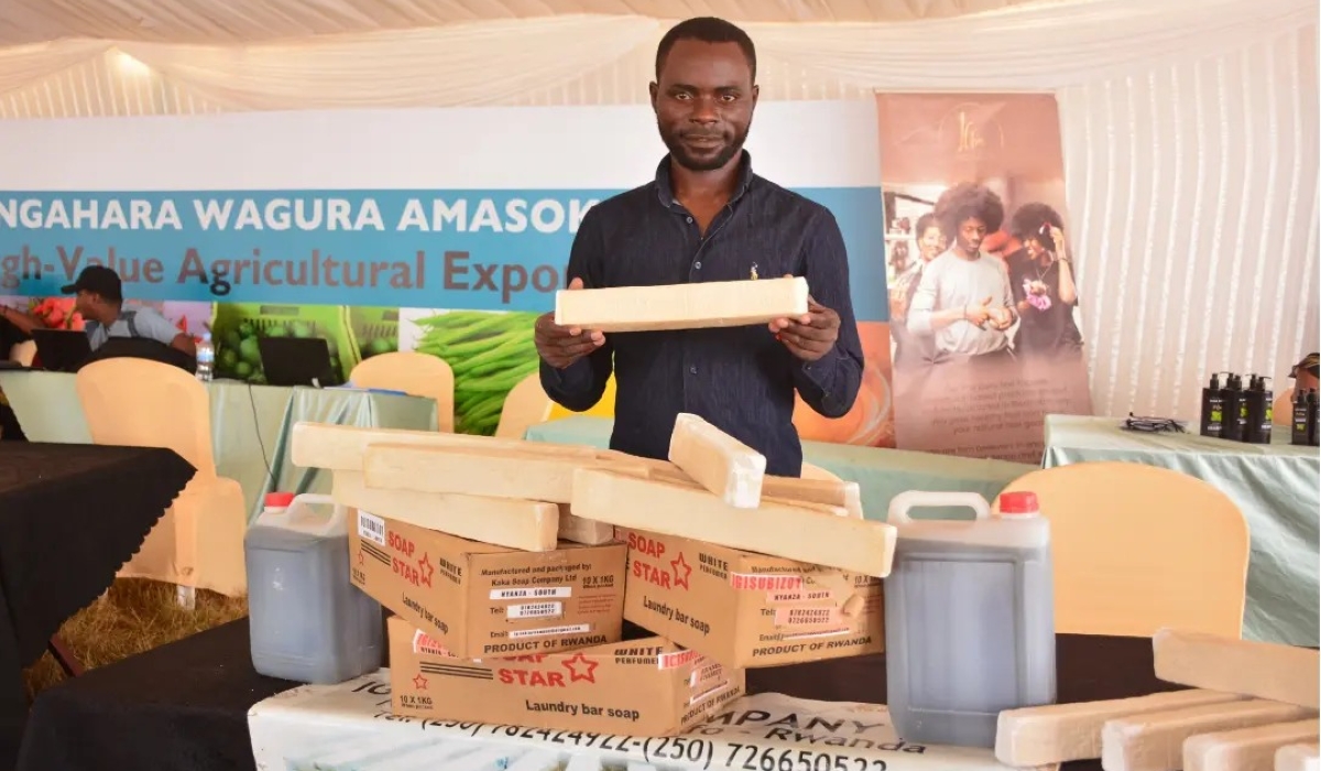 Entrepreneur Evariste Sibobugingo poses for a photo in an exhibition where he was showcasing how he transforms cassava peels into oil for soap production. Courtesy