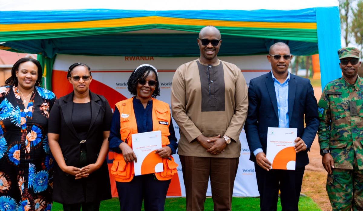 Officials pose for a group photo at the handover ceremony.