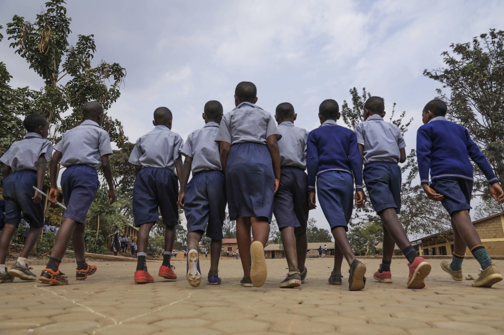 Students walk around at Group Scolaire Rugando. Craish Bahizi