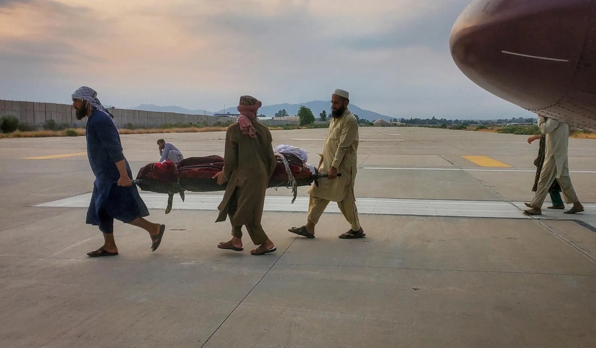 A person wounded in the quake was carried to an ambulance at an airport in Jalalabad, Afghanistan, on Monday. REUTERS
