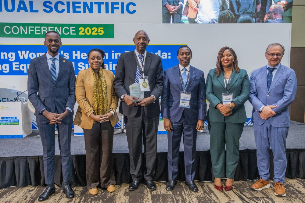 Officials pose for a group photo at the conference in Kigali