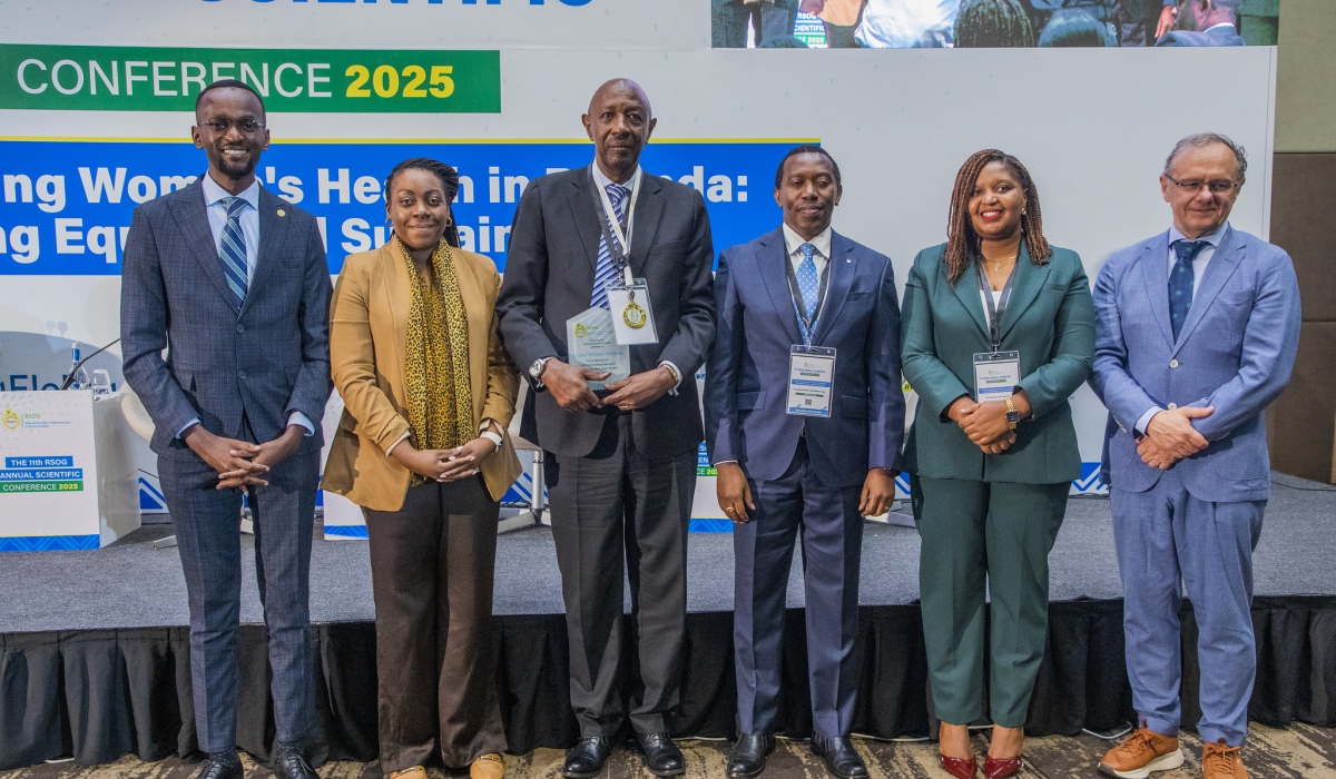 Officials pose for a group photo at the conference in Kigali