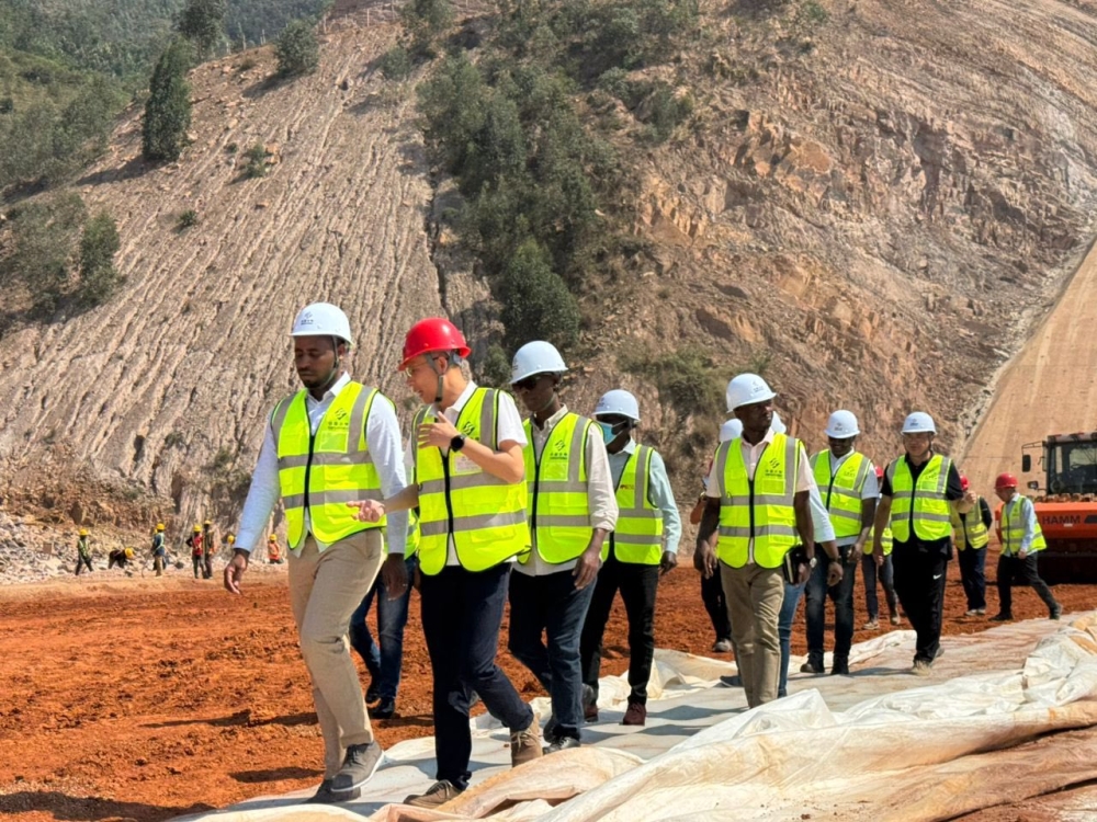 State Minister Jean de Dieu Uwihanganye (1st) and other officials during a guided tour of the ongoing construction activities at Nyabarongo Multipurpose Dam. Courtesy