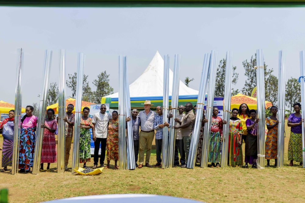SKOL Brewery and FXB Rwanda officials hand over the donation to their beneficiaries. Courtesy
