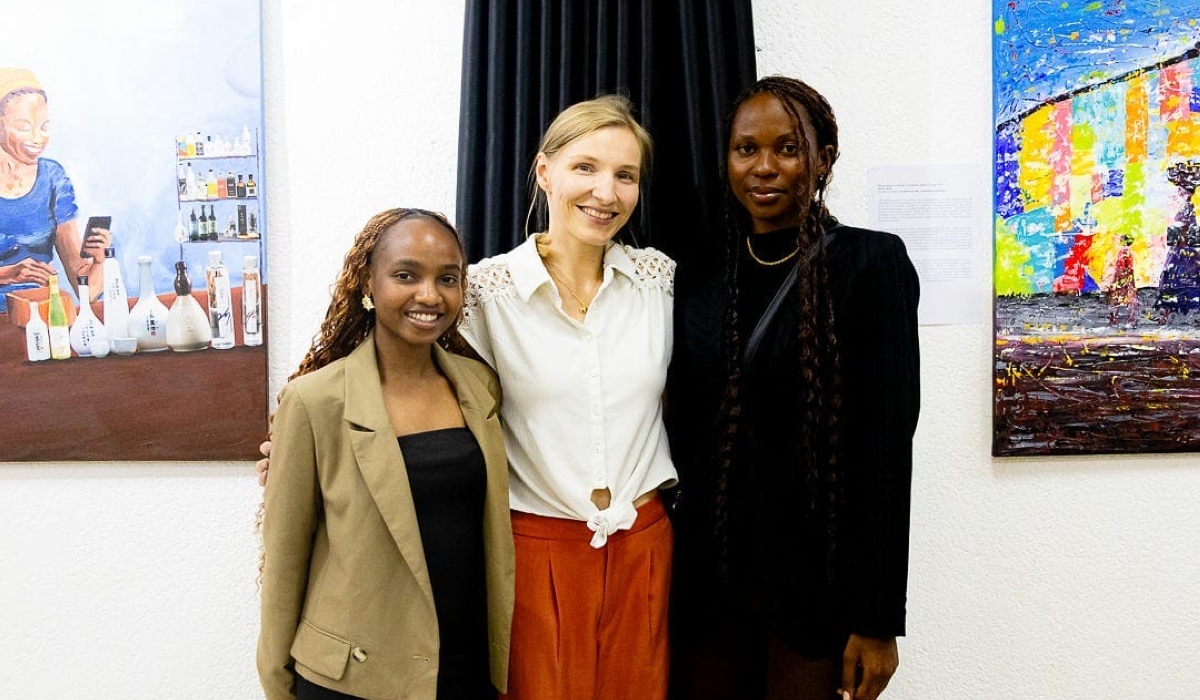 Rwandan female artists Inès Barbara Ineza and Ingrid Mukundente pose for a photos with an painting enthusiast during the Threads of Becoming exhibition at Institut Français du Rwanda on Tuesday, September 2. Photo: Courtesy