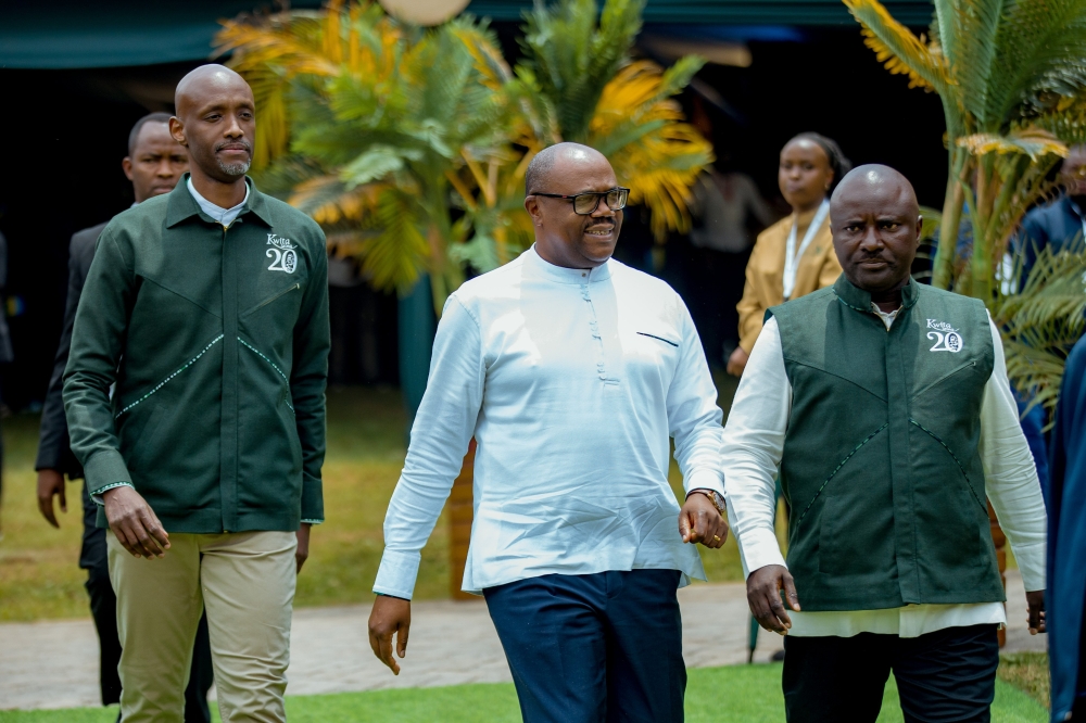 Prime Minister Justin Nsengiyumva (c) arrives in Kinigi for  Kwita Izina ceremony accompanied by RDB CEO Jean Guy Afrika and the Governor of North Province  Maurice Mugabowagahunde.