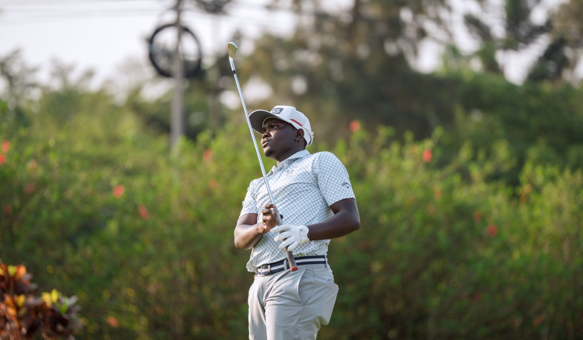 Rwanda&#039;s Celestin Nsanzuwera follows the path of his tee shot during the second round of the SportsBiz Africa Golf Championship at the Kigali Golf Resort -1