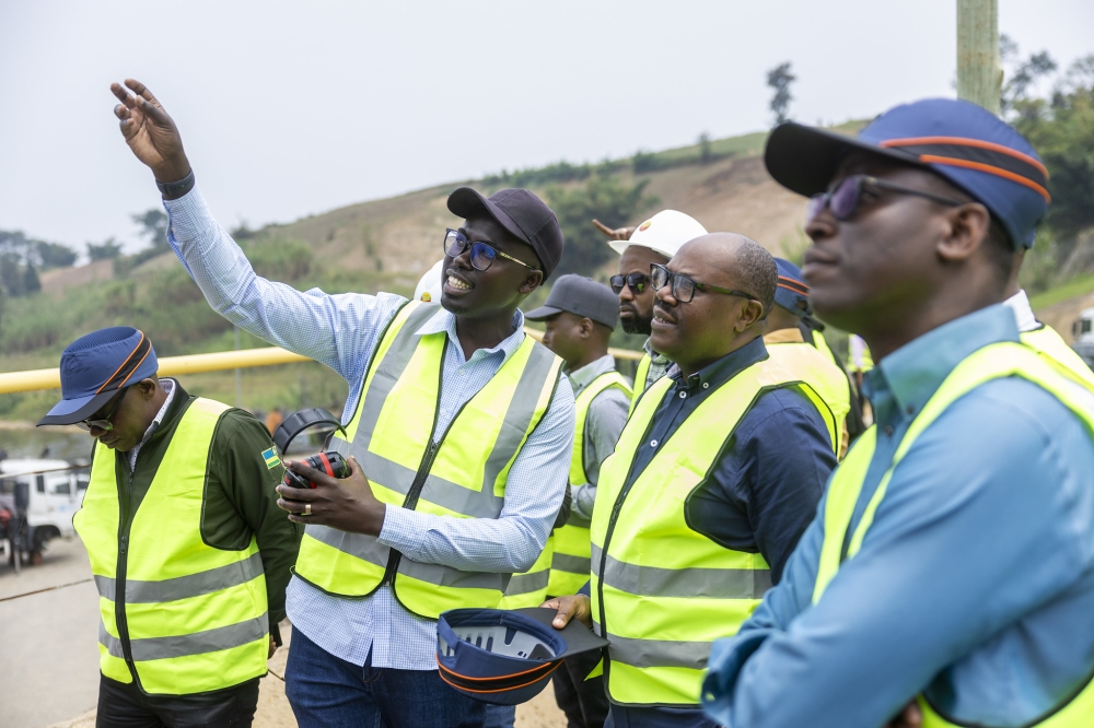 The Prime Minister (centre) flanked by other officials during a guided  tour of Shema power plant on Saturday, on September 6, in Rubavu Districtr. ALL PHOTOS BY OLIVIER MUGWIZA
