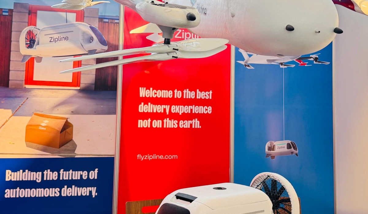 American unmanned aerial logistics firm Zipline’s next-generation autonomous aircraft designed specifically for urban delivery, on display at the Aviation Africa Summit, in Kigali, on September 4, 2025. The device on the table, which holds a package, is fitted into the drone and lowered when it reaches a destination to safely deliver a package (Emmanuel Ntirenganya)