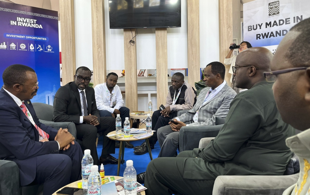 Sina Gerard of Entreprise Urwibusto is among exhibitors who are showcasing their products in Algeria. Seen here speaks to Rwandan delegations at the venue.