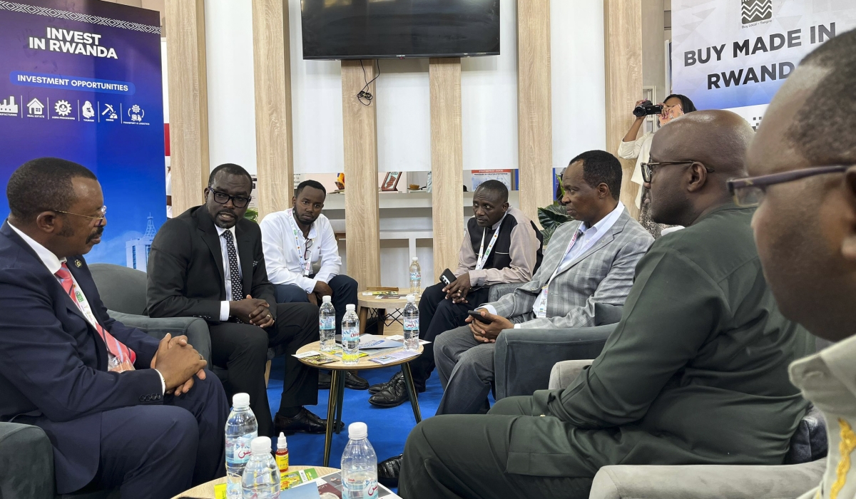Sina Gerard of Entreprise Urwibusto is among exhibitors who are showcasing their products in Algeria. Seen here speaks to Rwandan delegations at the venue.