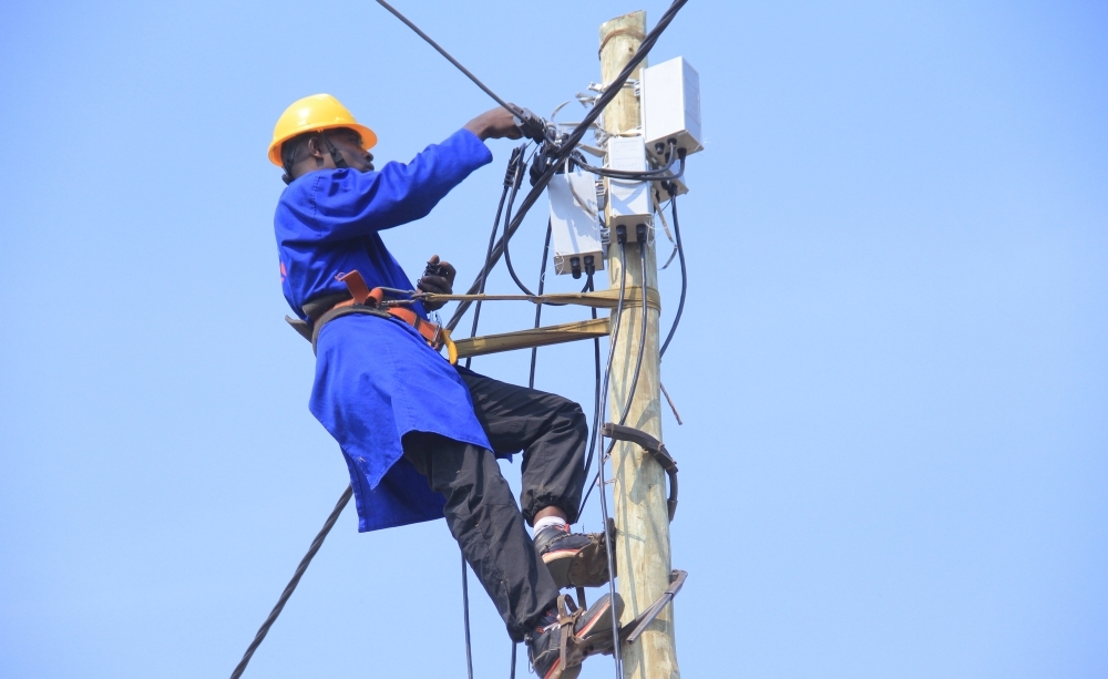 Rwanda Energy Group technician during electrical installation. The Minister of Infrastructure, Jimmy Gasore, is set to appear in Parliament on Tuesday afternoon to respond to issues related to Rwanda’s electricity production.
